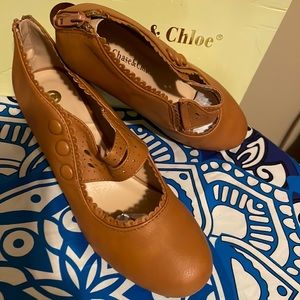 Heels barely worn button embellishments  zipper in back slip on tan size 8